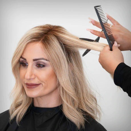 Lady wearing a human hair wig being styled