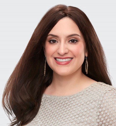 Smiling lady with Alopecia wearing a Hair Topper